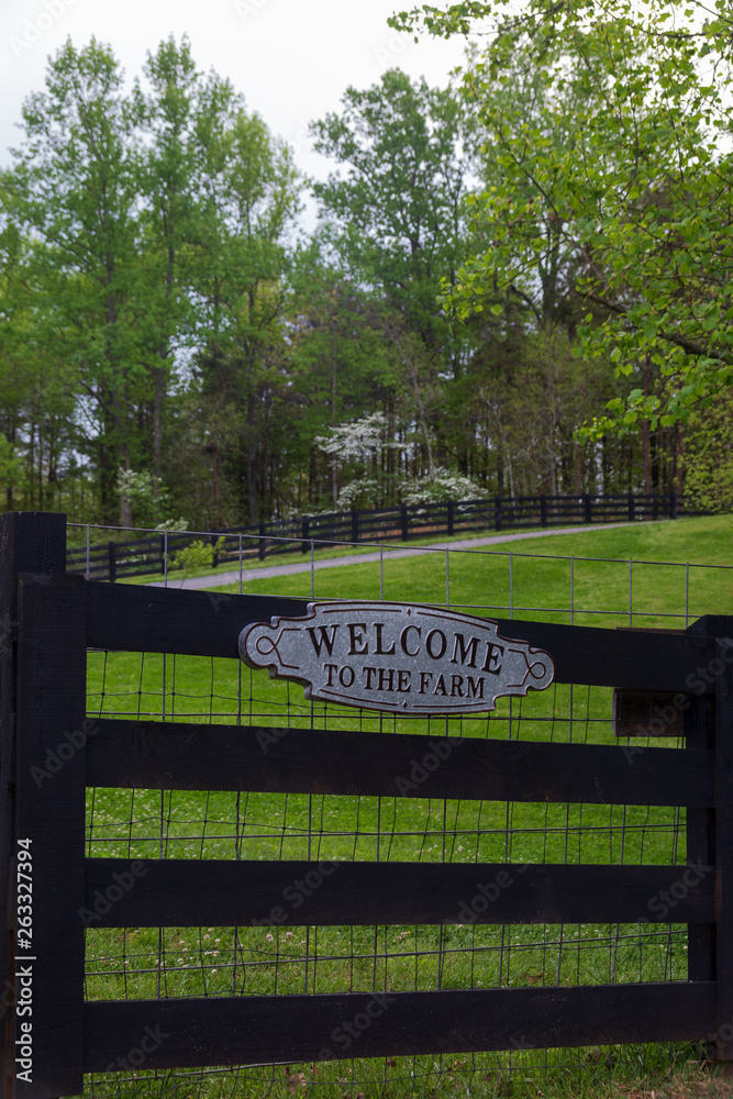 Welcome gate at the farm in the country.