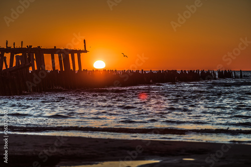 Sunset and old bridge ruins in Sventoji Lithuania