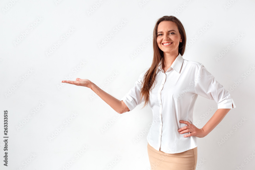 Freestyle. Man in formal wear standing isolated on gray holding glasses touching head having headache stressed Freestyle. Man in formal wear standing isolated on gray holding glasses touching head having headache stressed