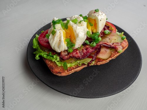 Toast with bacon, tomato ,pickle and boiled eggs
