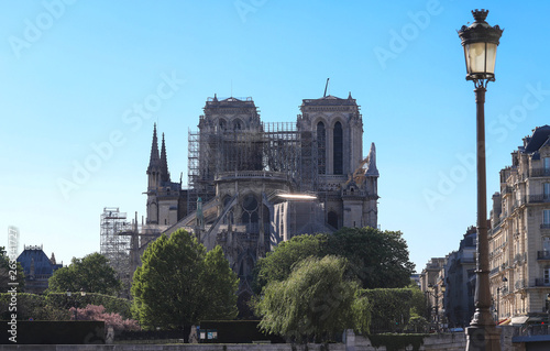 The view of Notre Dame cathedral without roof and spire destroyed by the fire , Paris.