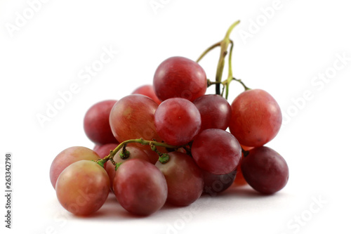 bunch of red grapes isolated on white background © feardaused69