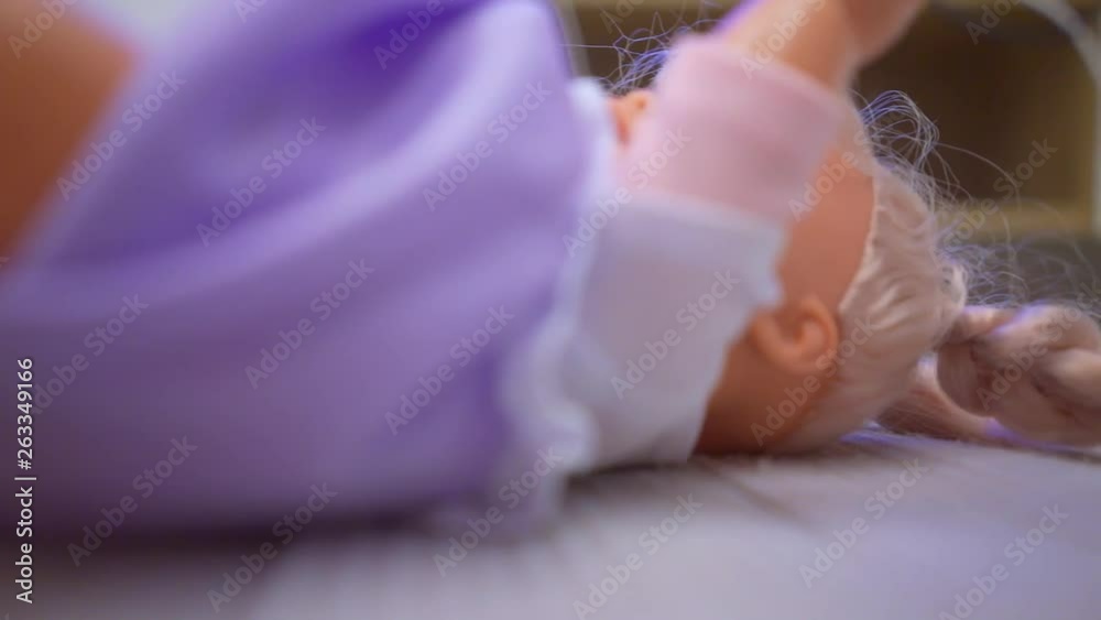 baby doll close up lying on the surface baby doll close up lying on the surface