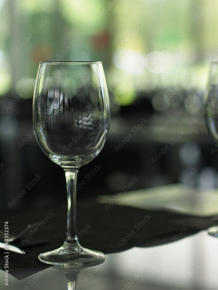Close-up of empty wine glasses on a table at a restaurant