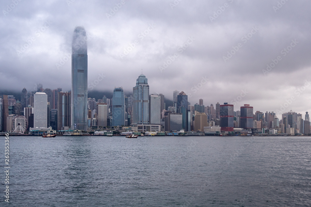 Beautiful panorama view of hong kong city and river on overcast and clouds sky background Beautiful panorama view of hong kong city and river on overcast and clouds sky background