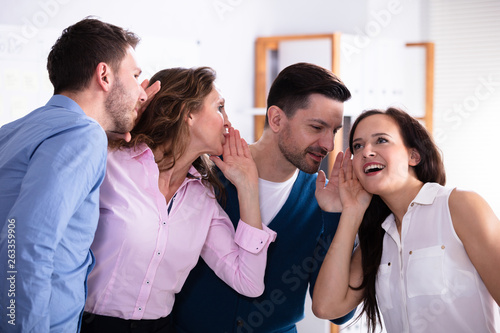 Photography Secretive Business Colleagues Whispering In The Office