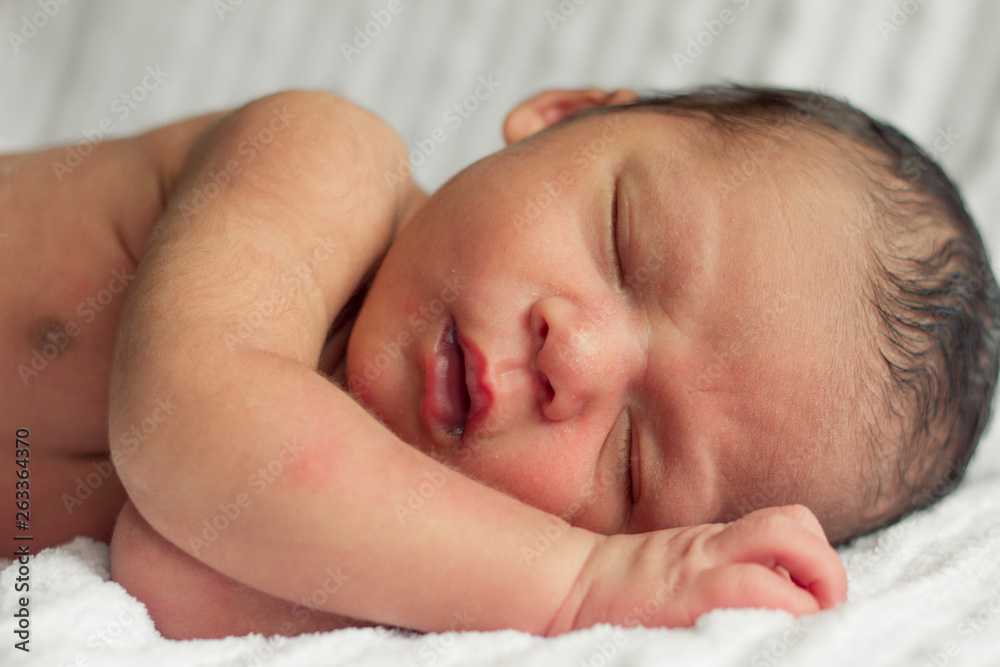 pop underjordisk pinion Mixed race sleeping baby boy Stock Photo | Adobe Stock