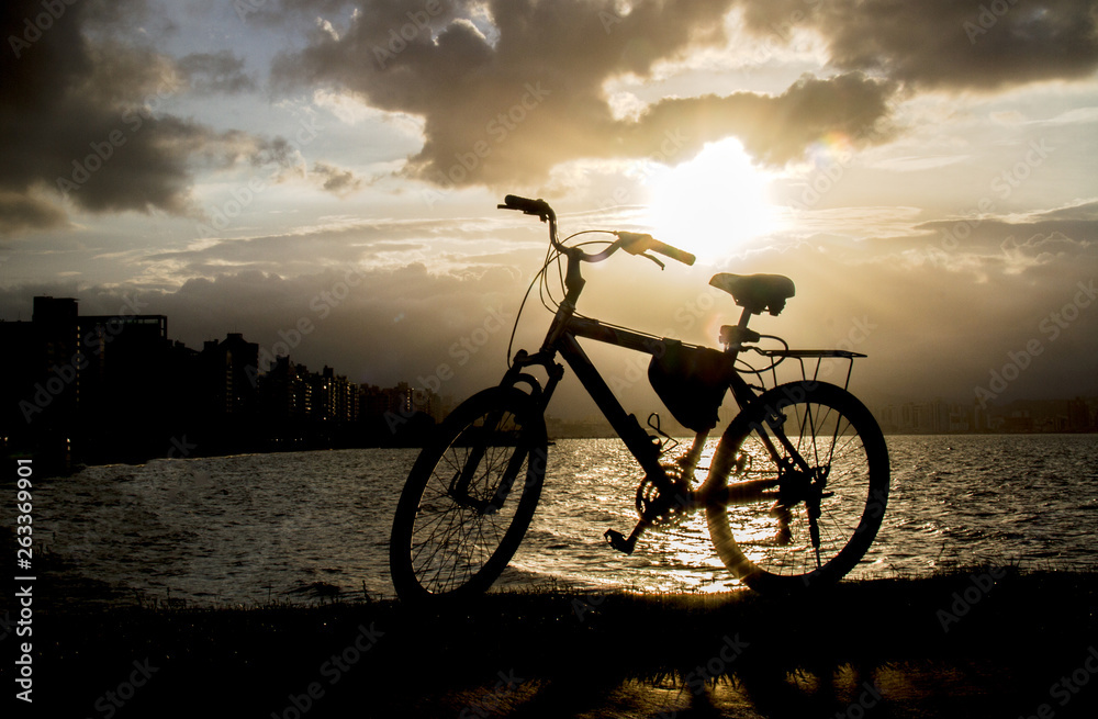 silhouette of bicycle on sunset silhouette of bicycle on sunset
