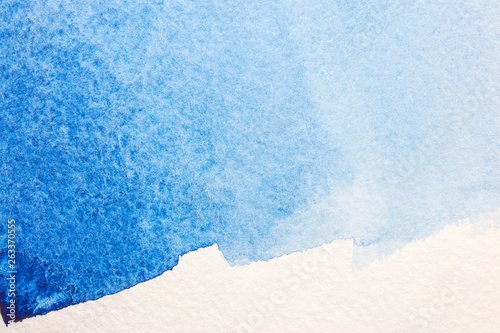 blue gradient color on textured watercolor paper
