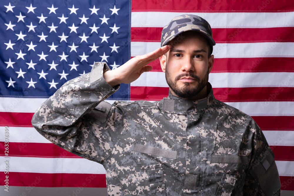 Wall Mural Solider Saluting Against The American Flag