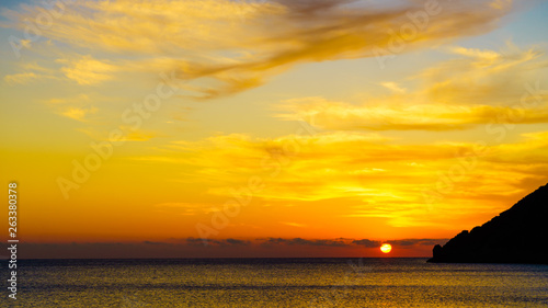 Sunrise or sunset over sea surface