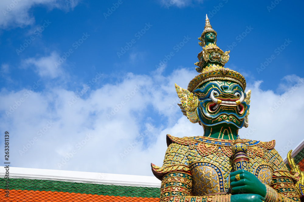 Fototapeta premium Giant statue in Wat Phra Keaw, Royal Grand Palace in Bangkok Thailand.