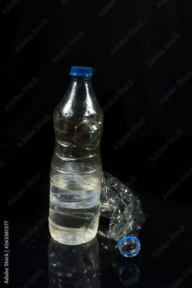 Plastic water bottle isolated on black background Plastic water bottle isolated on black background