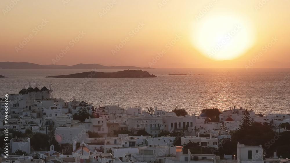 sunset at the town of chora on mykonos, greece