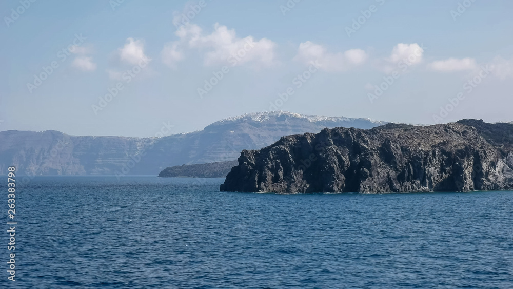 the village of thira on santorini as seen from a ferry boat the village of thira on santorini as seen from a ferry boat