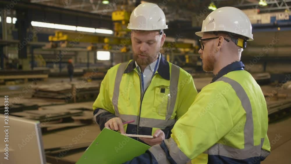 Portrait of a two engineers in a construction helmet