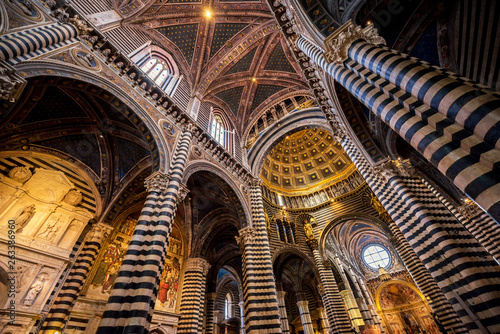 Beautiful architecture and interior of art in Siena Duomo . One of the most important examples of gothic architecture in Siena , Italy