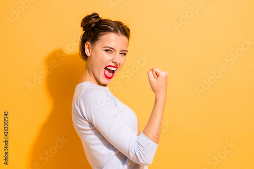 Profile side view portrait of her she nice cool attractive lovely winsome sweet cheerful cheery crazy girl breakthrough lucky isolated on bright vivid shine yellow background