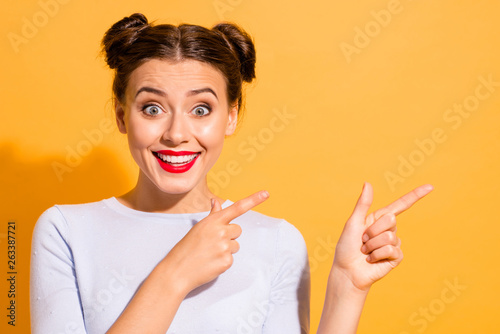 Look attentively Close up photo of crazy cute student isolated in white outfit over bright background advising trying huge incredible discount photo