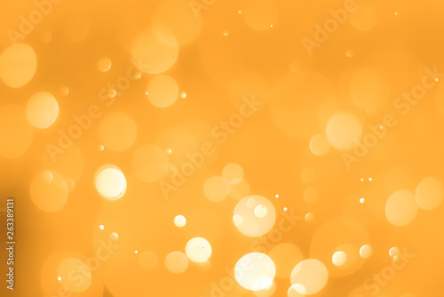 abstract glow orange background with soft blur bokeh light effect