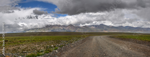 road gravel mountains steppe sky