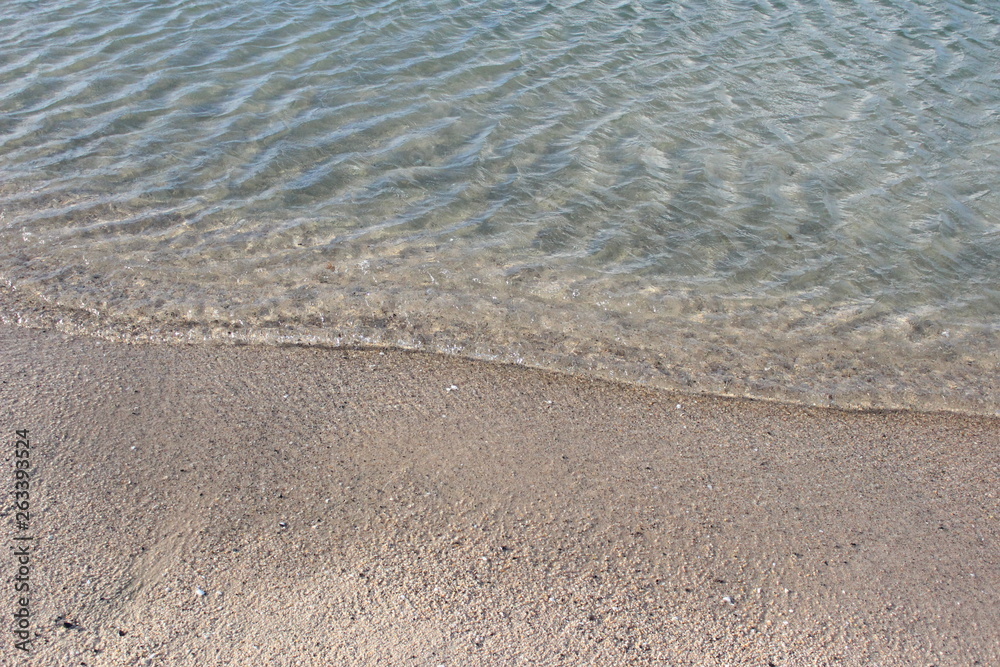 Waves washing up on sand