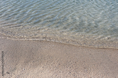 Waves washing up on sand