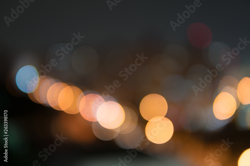 Abstract bokeh night garden in city background.Defocused city night filtered bokeh abstract background.