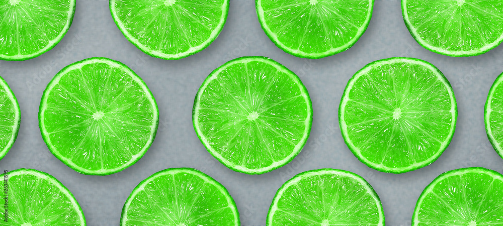 Sliced juicy lime on a gray background. Fresh fruits. Fruit background. Summer party. Birthday.