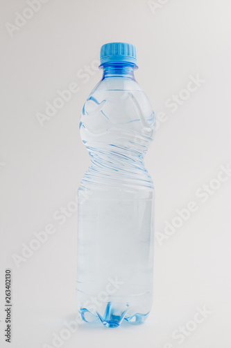 One single whole mockup bottle of water on white background