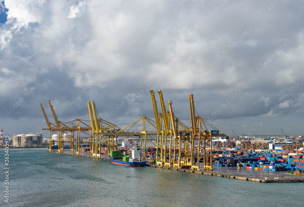 Panoramic view of the port in Barcelona with containers and cranes