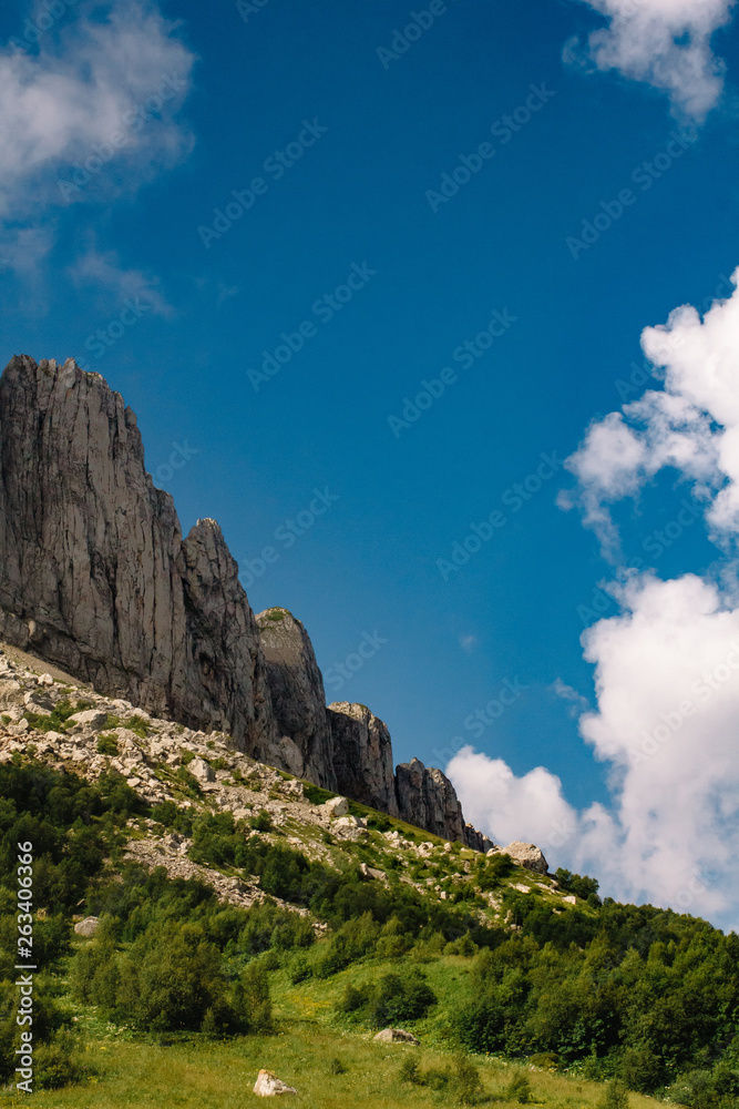 Beautiful summer mountain landscape with clouds and a sunny day. Background for text