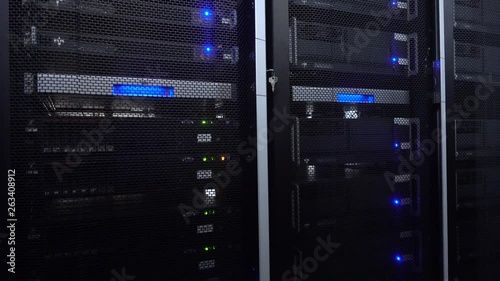Servers in data center. Servers racks close up in Modern data center. Cloud computing datacenter server room. Motion camera.