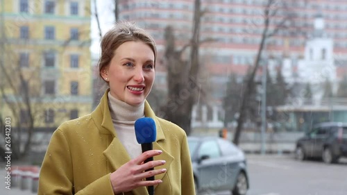 Beautiful girl reporter broadcasts