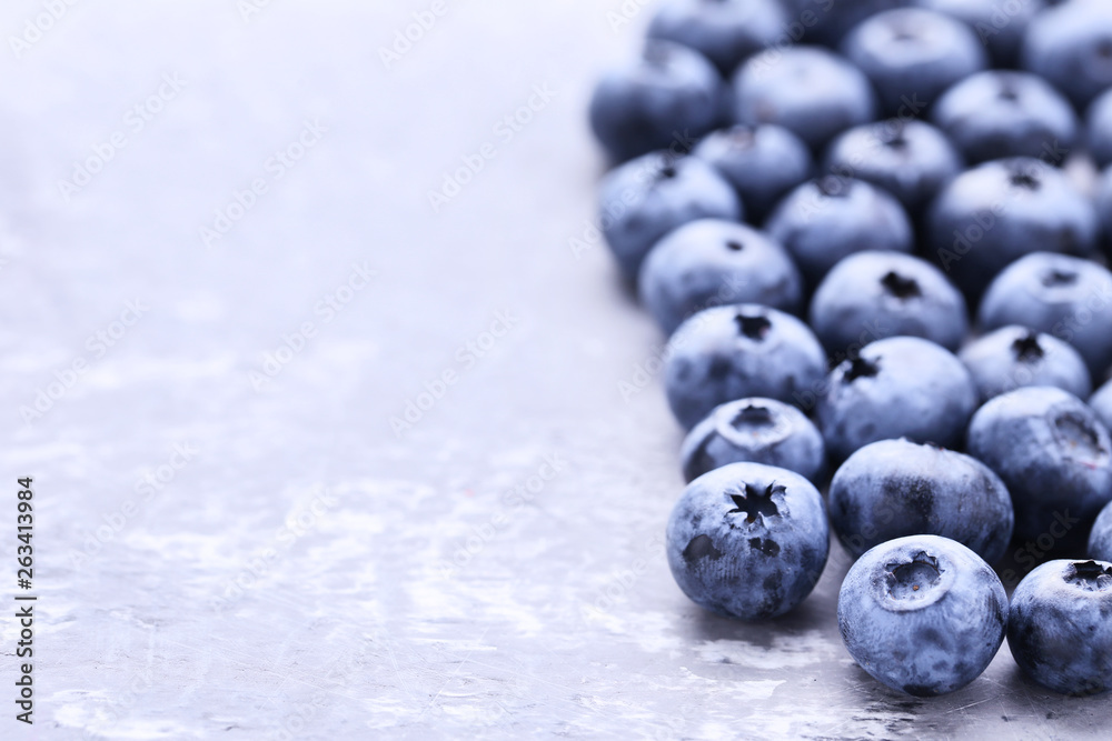 Ripe blueberries on grey background Ripe blueberries on grey background