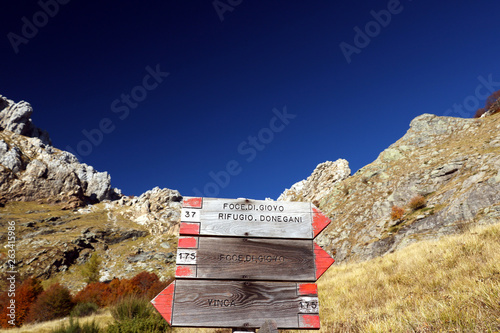 Alpi Apuane, Massa Carrara, Tuscany, Italy. Signposts indicating mountain trails. Directions for the towns of Vinca, Foci di Giovo, Rifugio Donegani. photo