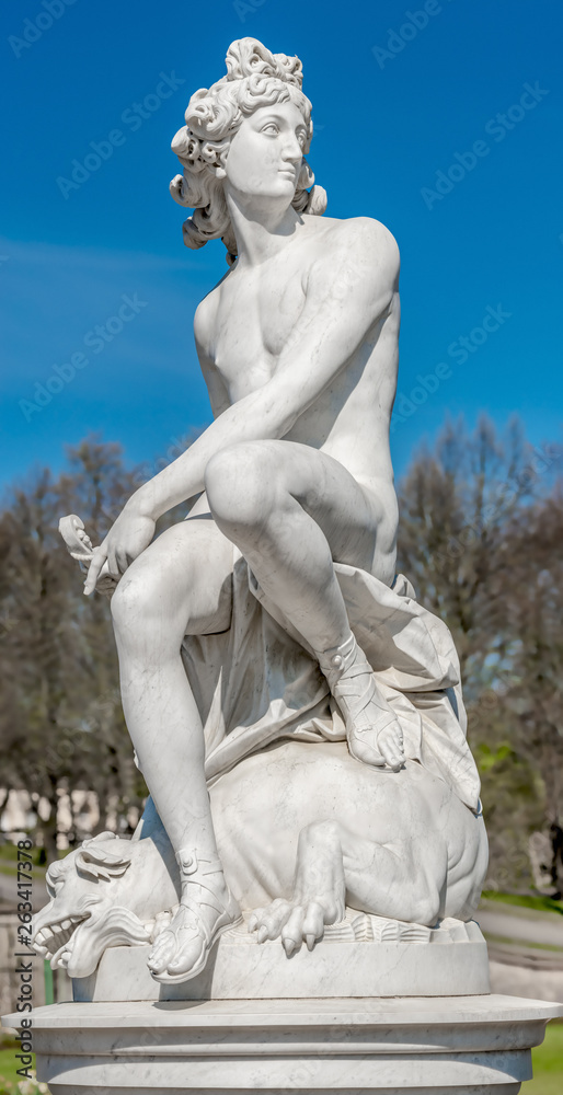 Ancient statue of sensual Italian renaissance rococo era a hunter in Potsdam, Germany