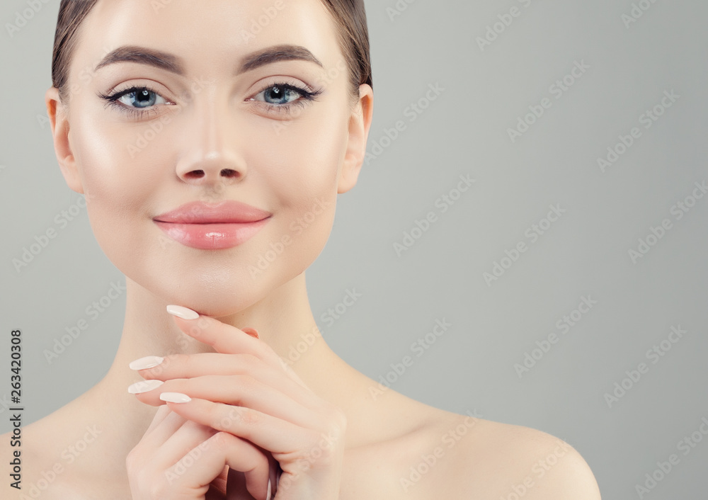 Beautiful woman face close up portrait. Healthy model with clear skin. Skincare and facial treatment concept Beautiful woman face close up portrait. Healthy model with clear skin. Skincare and facial treatment concept