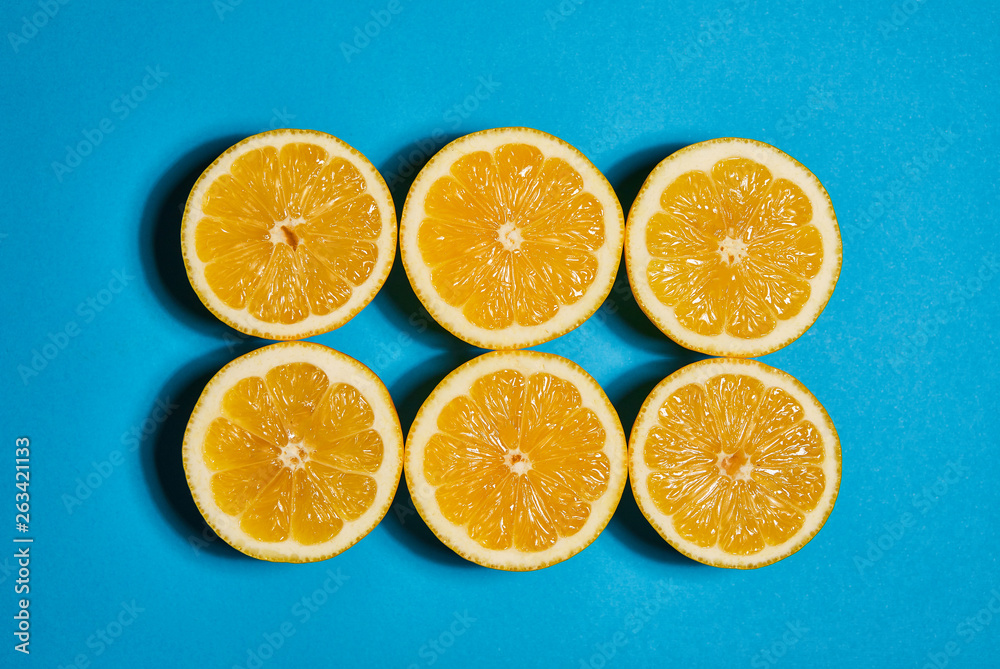 Lemon on blue background. Flat lay, top view, copy space . Food concept. Lemon on blue background. Flat lay, top view, copy space . Food concept.