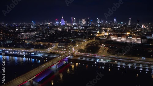 Wallpaper Mural Night City Aerial Timelapse. City skyline background. Aerial view of Warsaw capital city of Poland. From above, night city view with night sky. Night panorama of Warsaw cityscape. Torontodigital.ca
