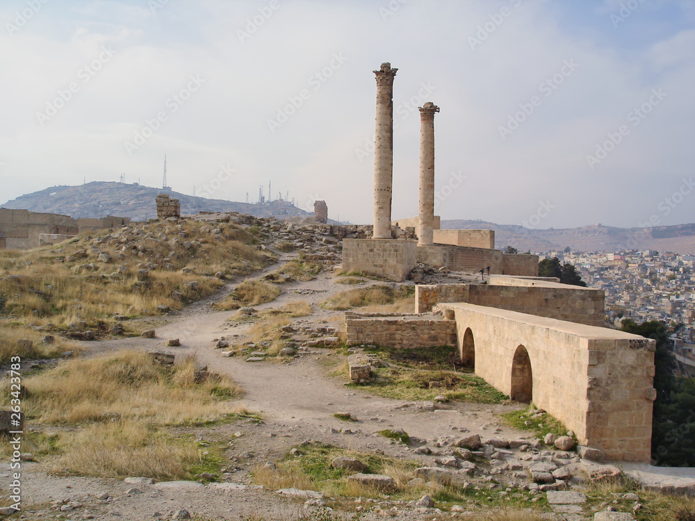 Ruins of Sanliurfa Castle with two columns of Korinth heads over the castle. These famous columns are known as 