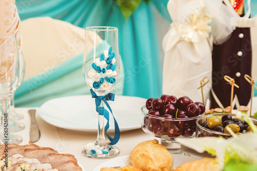 beautiful champagne glass decorated with blue flowers.