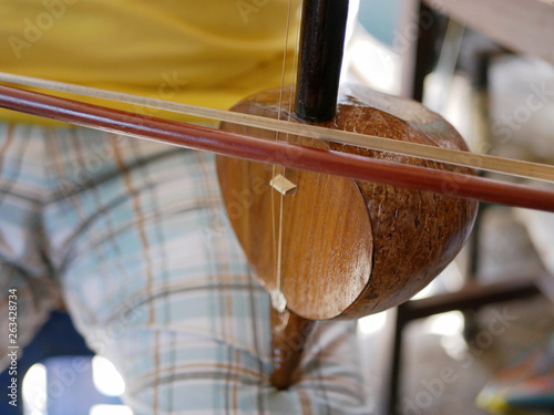 Close up of Salor being played, two or three-string spike fiddle used in the Lanna region or in the North of Thailand photo