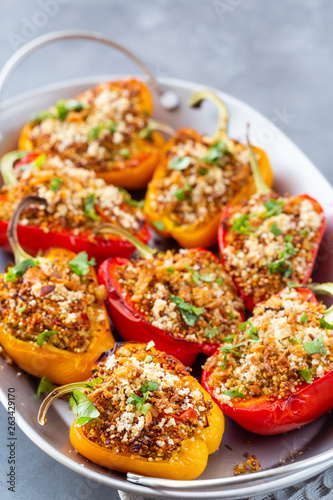 Close-up of bell peppers stuffed with quinoa. Diet concept of healthy vegetarian food.