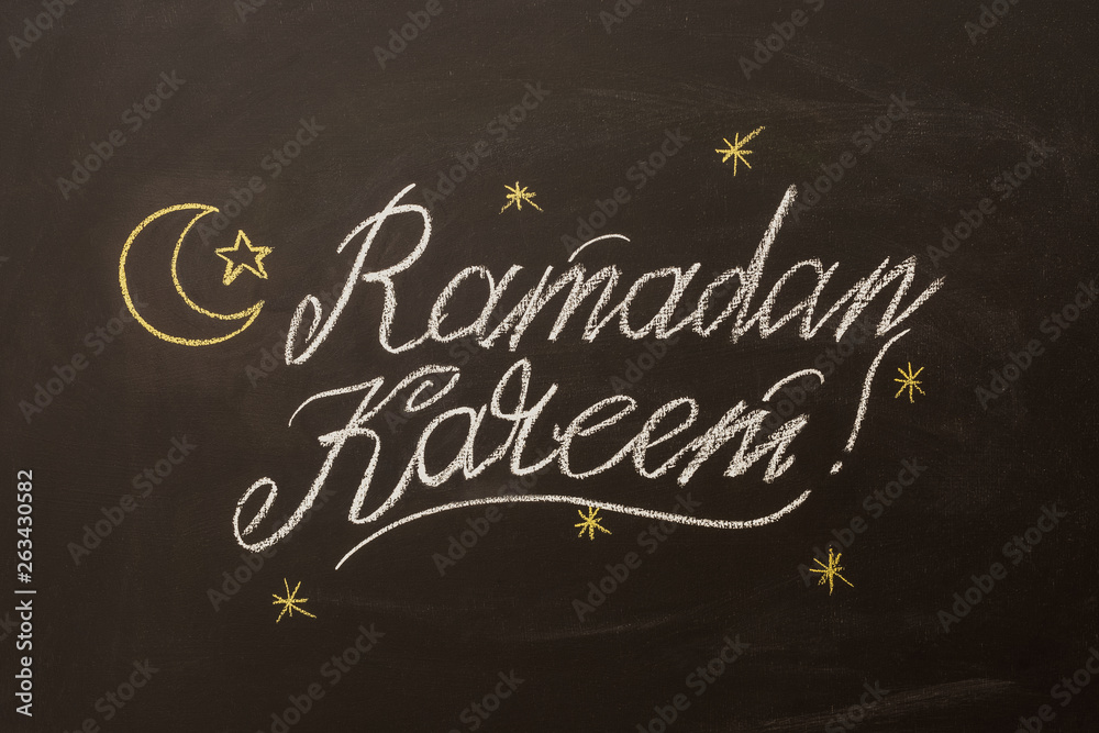 Beautiful Ramadan Kareem text on chalkboard