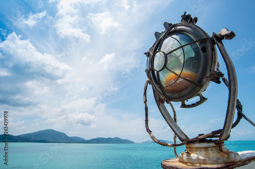 tropical sea with old spotlight on ferry ship,ferry ship to Koh-samui,travel in holiday concept