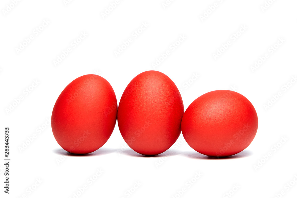 Three red Easter eggs isolated on white background. Traditional symbol of Christian holiday Three red Easter eggs isolated on white background. Traditional symbol of Christian holiday