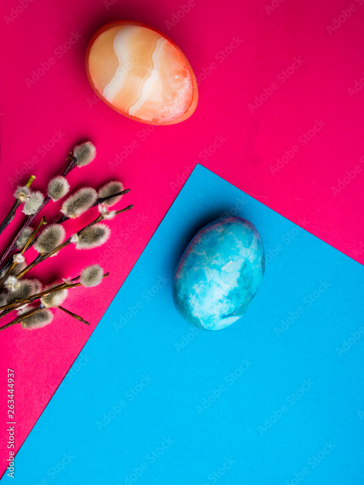 easter holidays postcard, colorful easter eggs and pussy willow branches on blue pink background easter holidays postcard, colorful easter eggs and pussy willow branches on blue pink background