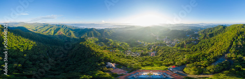 panoramic landscape and over the sunlight with blue sky background on the mountain at morning mist