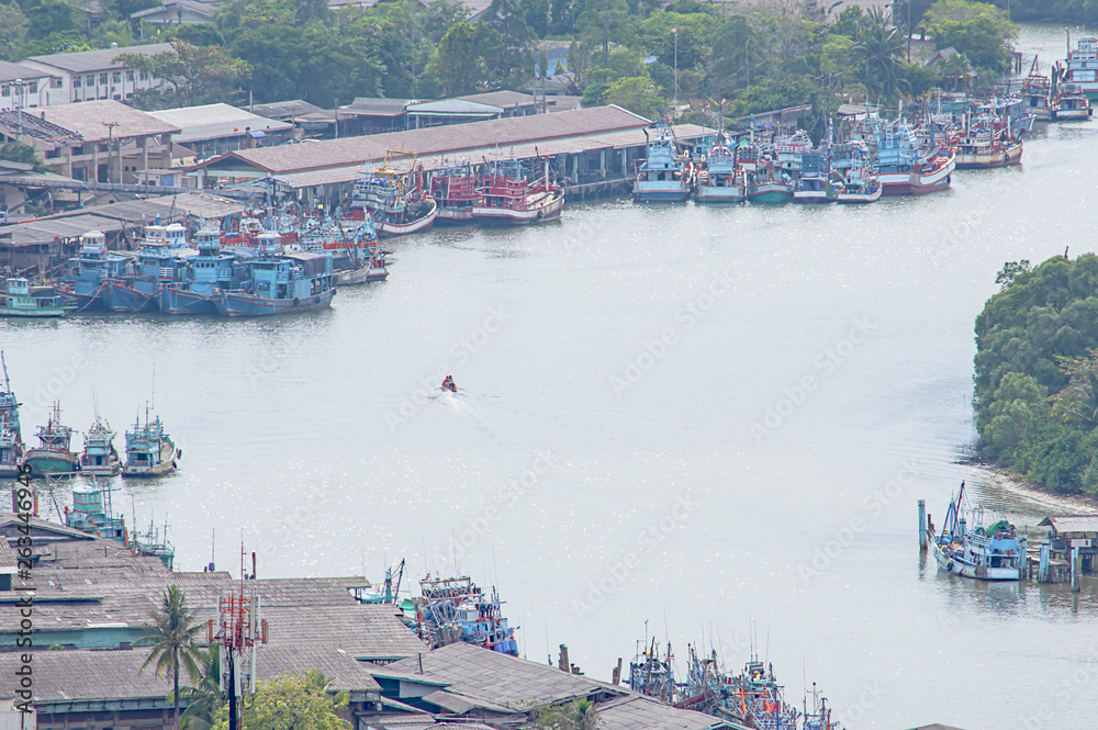 Fishing boats parked in Tha Taphao river access to the sea at Mutsea Mountain Viewpoint in Chumphon , Thailand.